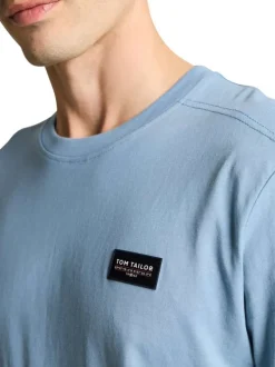 T-shirt en coton ciel uni avec une coupe droite et un col rond