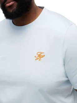 T-shirt en coton ciel uni pourvu d'un col rond et de manches courtes