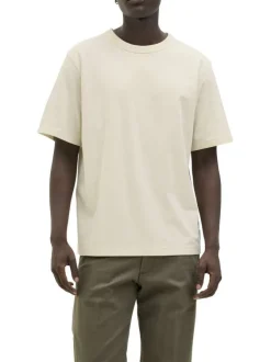 T-shirt en coton écru pourvu d'une coupe droite et d'un col rond