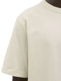 T-shirt en coton écru pourvu d'une coupe droite et d'un col rond