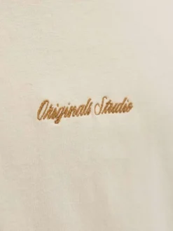 T-shirt en coton écru uni avec un col rond et des manches courtes