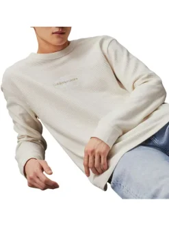 T-shirt en coton écru uni avec un col rond et des manches longues