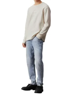 T-shirt en coton écru uni avec un col rond et des manches longues