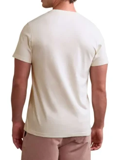 T-shirt en coton écru uni avec une coupe droite et un col rond