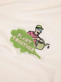 T-shirt en coton écru uni avec une coupe droite et un col rond
