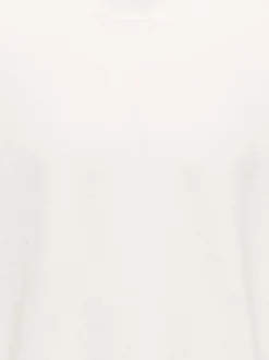 T-shirt en coton écru uni avec une coupe oversize et un col rond
