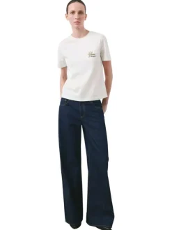 T-shirt en coton écru uni pourvu d'un col rond et d'une coupe droite