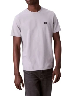 T-shirt en coton gris clair uni avec un petit patch brodé et à col rond