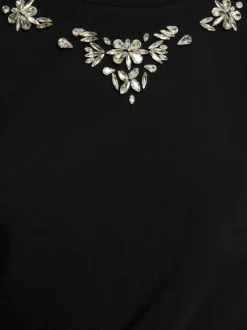 T-shirt en coton noir à coupe droite pourvu d'un col rond et de manches courtes