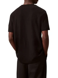 T-shirt en coton noir uni à col rond avec le mini logo brodé à la poitrine