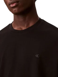 T-shirt en coton noir uni à col rond avec le mini logo brodé à la poitrine