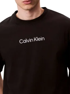 T-shirt en coton noir uni coupe ajustée col rond avec un logo blanc