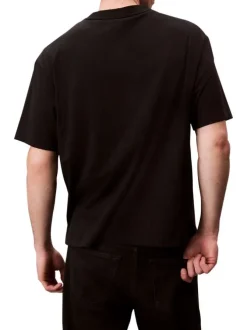 T-shirt en coton noir uni coupe ajustée col rond avec un logo blanc