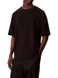 T-shirt en coton noir uni à coupe oversize avec le nom de la marque brodé