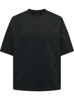 T-shirt en coton noir uni épais avec une coupe très oversize et un col rond