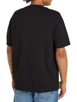 T-shirt en coton noir uni texturé avec un col rond et une coupe droite