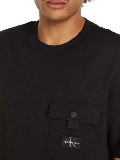 T-shirt en coton noir uni texturé avec un col rond et une coupe droite