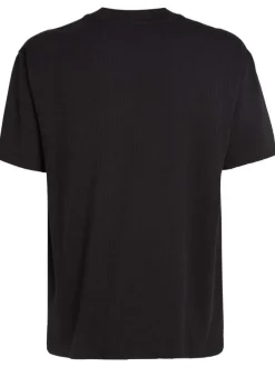 T-shirt en coton noir uni texturé avec un col rond et une coupe droite