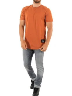 T-shirt en coton orange uni avec patch d'authentification cousu