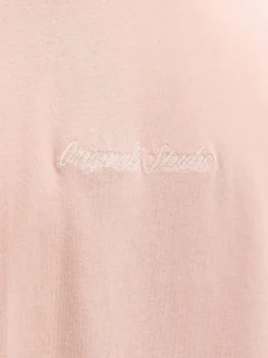 T-shirt en coton rose pourvu d'un col rond et de manches courtes