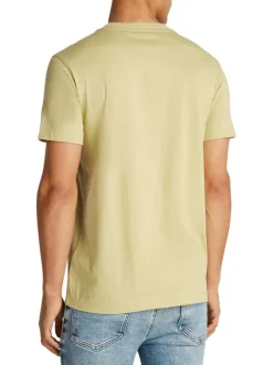 T-shirt en coton vert tilleul uni avec un col rond et un petit patch écru