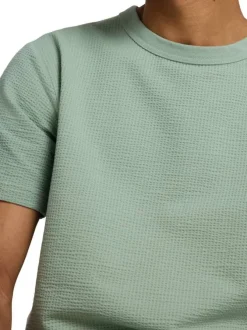 T-shirt en gaze de coton vert uni avec un col rond et une coupe droite
