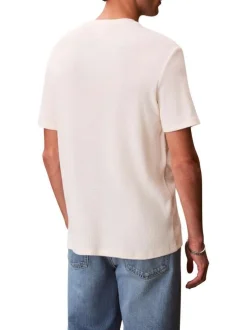 T-shirt jaune uni en maille piquée avec une coupe droite et un col rond