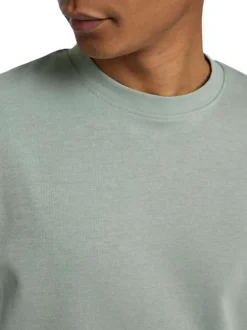 T-shirt épais vert chiné avec une coupe oversize et un col rond