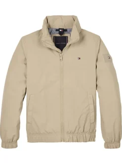 Veste beige uni avec une coupe droite à col montant et fermeture zippée