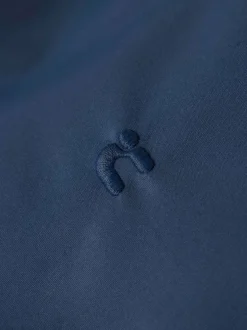 Veste imperméable marine unie pourvue d'une capuche et de manches longues