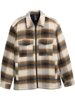 Veste beige à motif écossais avec un col chemise et manches longues