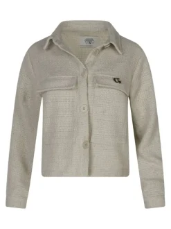 Veste beige unie pourvue d'une coupe droite et de manches longues