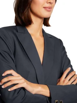 Veste blazer marine unie avec une coupe droite et des manches longues