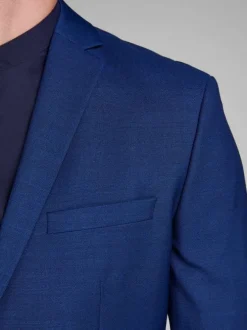 Veste bleue à coupe ajustée à col à revers et fermeture boutonnée