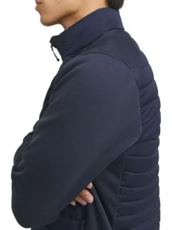 Veste bleue marine matelassée avec une coupe droite et un col montant à zip
