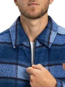 Veste bleu marine à carreaux effet lainage avec un col chemise