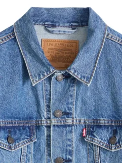 Veste en coton bleu à coupe ajustée pourvu d'un col à revers