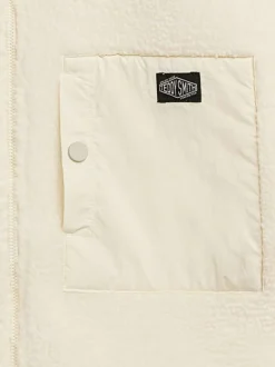 Veste sans manches écrue unie zippée en sherpa avec un col montant